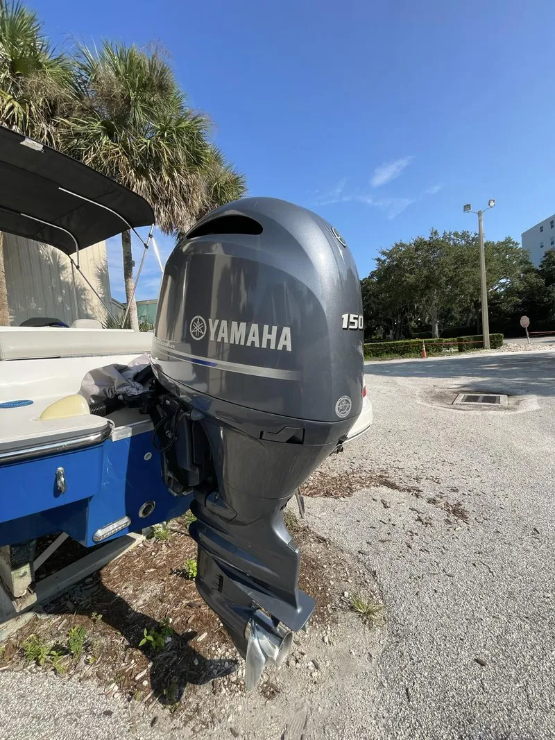 Slide: The Image of 2017 Starcraft MDX 211 O/B with Yamaha 150 outboard motor, parked outdoors. - 7