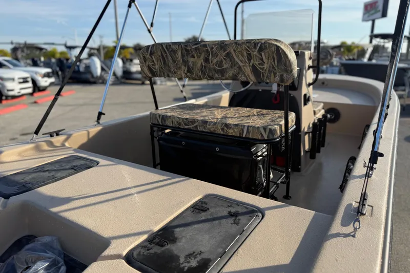 Slide: The Image of 2026 Carolina Skiff E18 JVX CC Sportsman Edition boat interior with camo seating. - 10