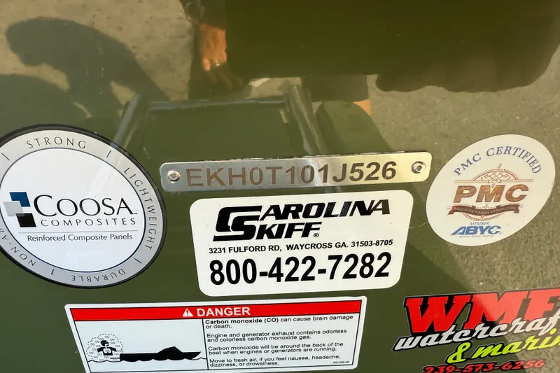 Slide: The Image of 2026 Carolina Skiff E18 JVX CC Sportsman Edition with certification and safety labels. - 22