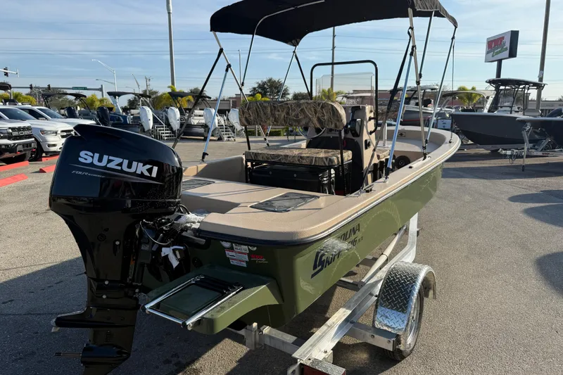 Slide: The Image of 2026 Carolina Skiff E18 JVX CC Sportsman Edition boat with Suzuki outboard motor. - 7