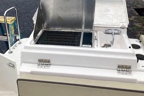 Slide: The Image of Outdoor kitchen on 2018 Ranger Tugs R-27 boat with grill and sink. - 11