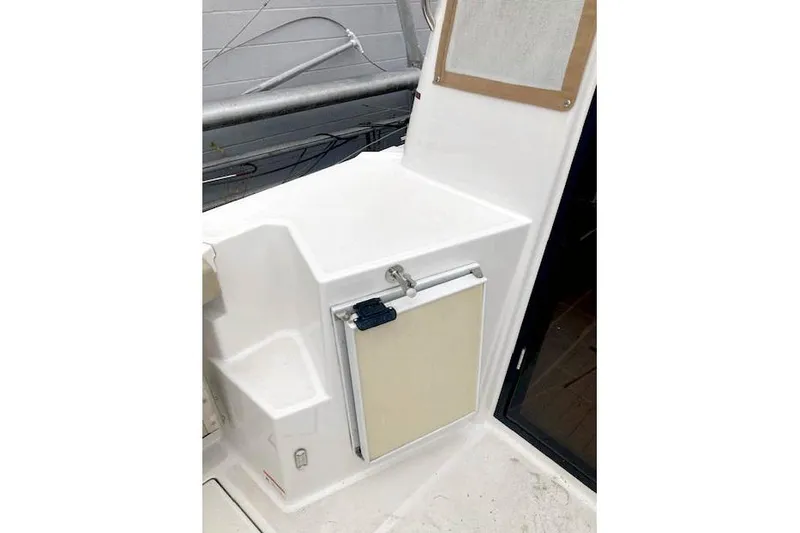 Slide: The Image of 2018 Ranger Tugs R-27 boat interior with compact storage compartment. - 13