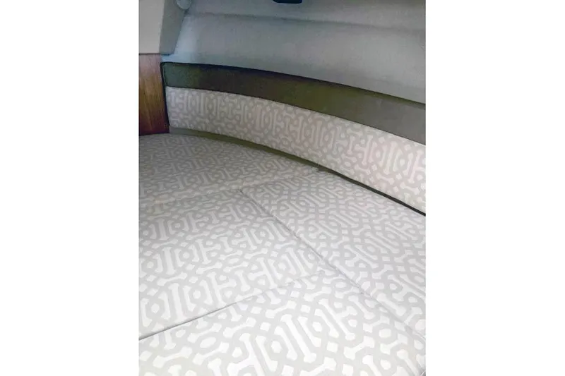 Slide: The Image of 2018 Ranger Tugs R-27 interior cabin with patterned upholstery. - 25