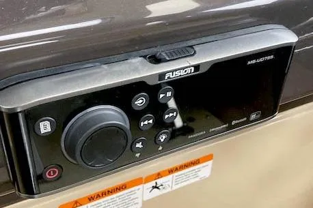 Slide: The Image of Fusion MS-UD755 audio system on 2018 Ranger Tugs R-27 boat dashboard. - 34
