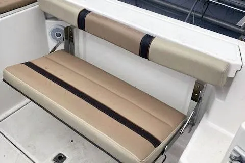 Slide: The Image of 2018 Ranger Tugs R-27 boat seat with beige and black upholstery. - 9