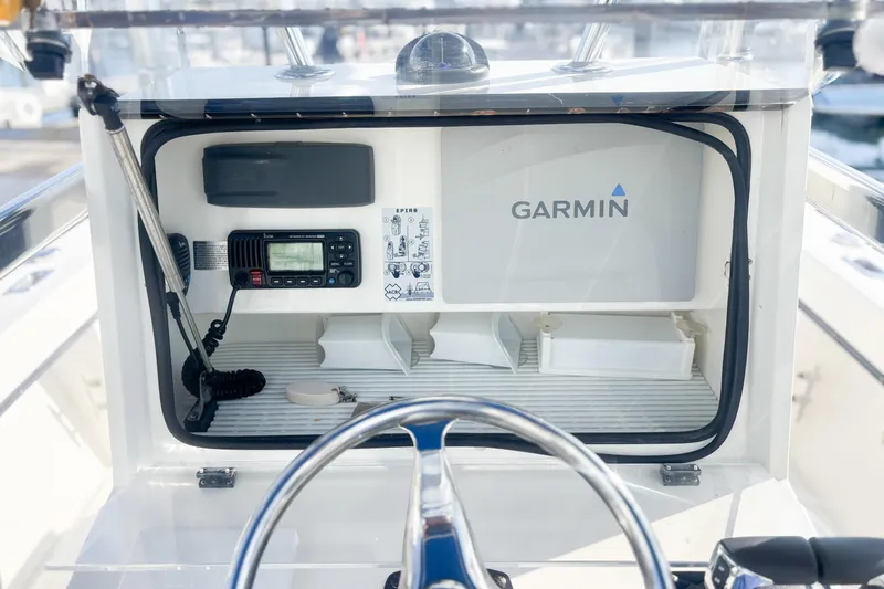 Slide: The Image of Center console of a 2016 Whitewater boat with Garmin navigation system. - 16