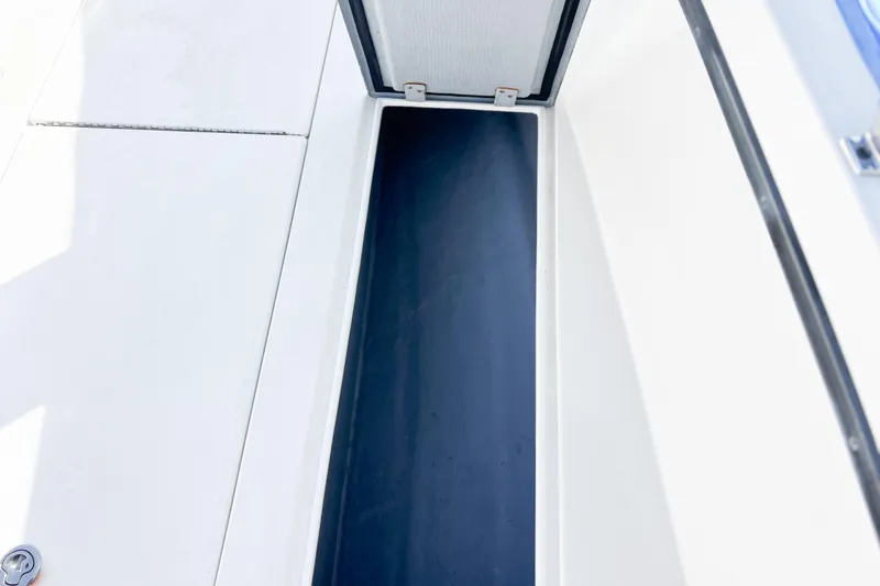Slide: The Image of Whitewater 2016 boat storage compartment with open lid, showcasing interior space. - 31