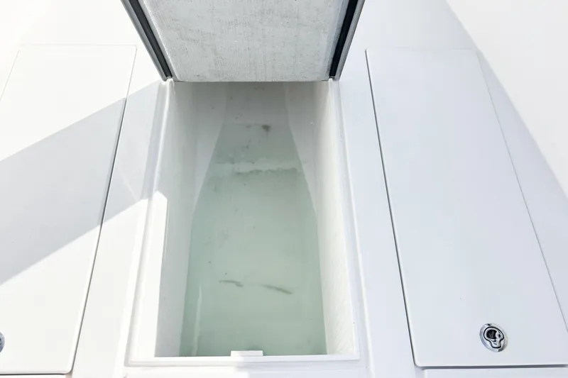 Slide: The Image of Open storage compartment on a 2016 Whitewater boat, featuring a sleek design. - 32