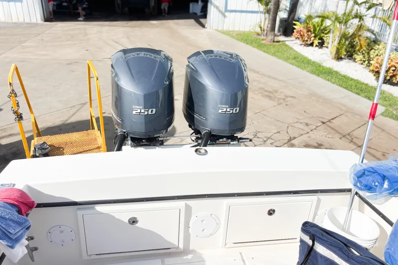 Slide: The Image of Twin Yamaha 250 outboard motors on a 2016 Whitewater boat, dockside view. - 37