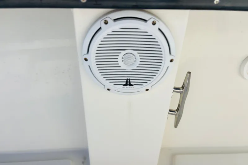 Slide: The Image of Twin Yamaha 250 outboard engines on a 2016 Whitewater boat, docked with equipment. - 38