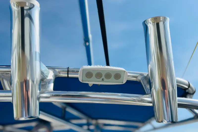 Slide: The Image of View from a 2016 Whitewater boat with blue canopy, overlooking a marina. - 41