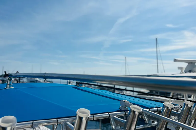 Slide: The Image of Close-up of a 2016 Whitewater boat's metal frame and mounted equipment under a clear sky. - 43