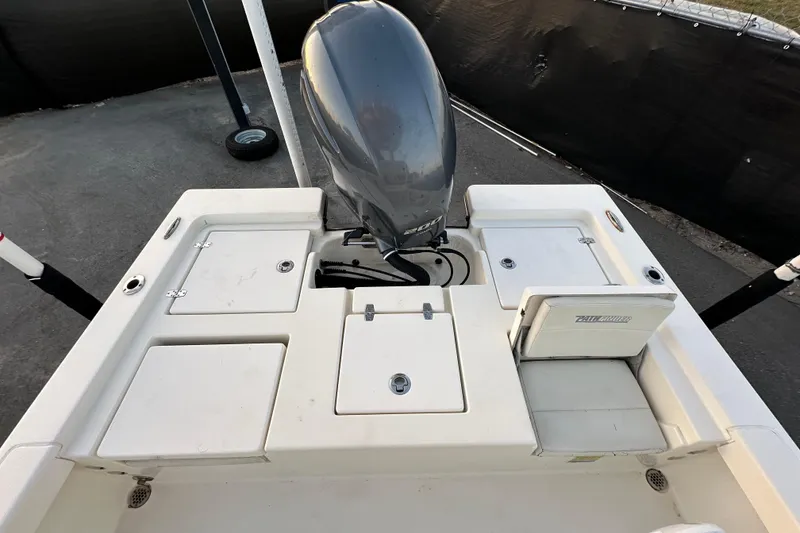 Slide: The Image of 2015 Pathfinder 2200 TRS boat on display at a marina under a clear blue sky. - 14