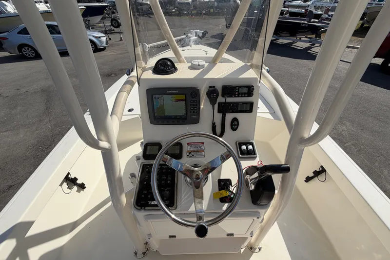 Slide: The Image of 2015 Pathfinder 2200 TRS boat control panel with switches and storage compartment. - 24