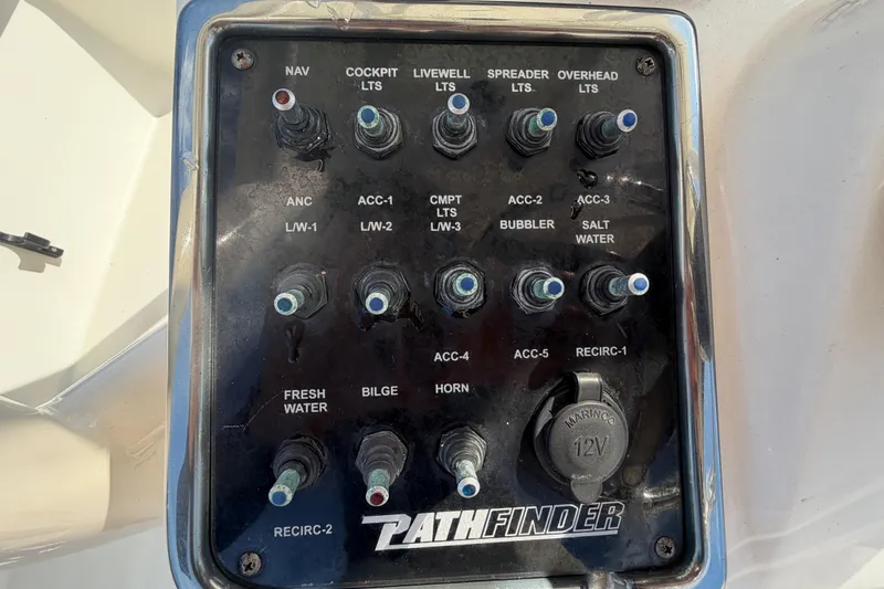 Slide: The Image of 2015 Pathfinder 2200 TRS boat detail with hatch and speaker, marina background. - 25