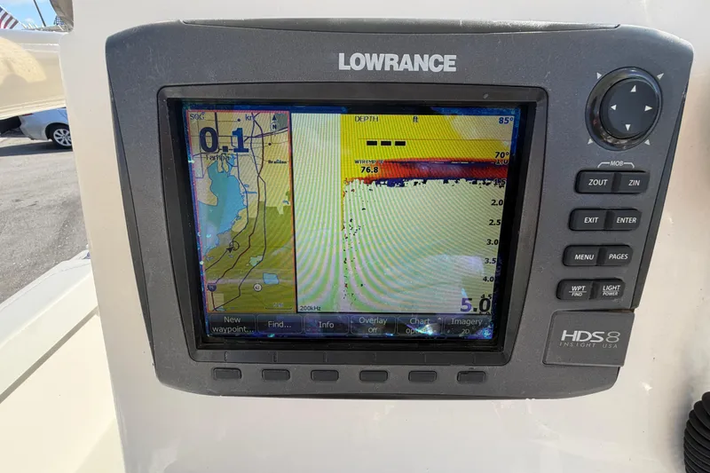 Slide: The Image of Open storage compartment in a 2015 Pathfinder 2200 TRS boat, showing wiring and interior details. - 26