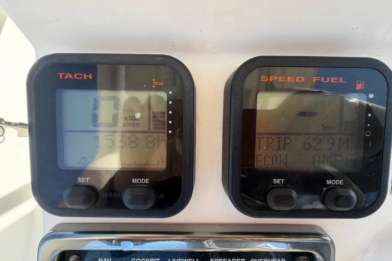 Slide: The Image of 2015 Pathfinder 2200 TRS boat compartment with chrome handle and model number. - 28