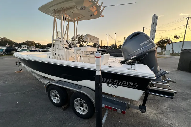 Slide: The Image of 2015 Pathfinder 2200 TRS boat with Yamaha engine on trailer, parked outdoors. - 3