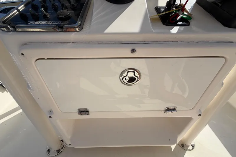 Slide: The Image of 2015 Pathfinder 2200 TRS boat interior with seating and storage compartments. - 31