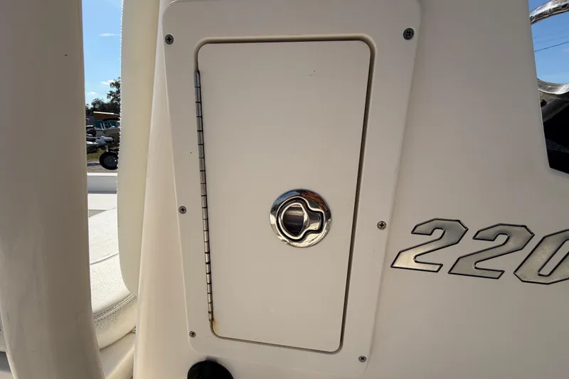 Slide: The Image of 2015 Pathfinder 2200 TRS boat deck with storage compartment and latch. - 36