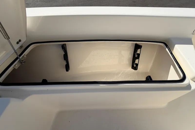 Slide: The Image of 2015 Pathfinder 2200 TRS boat on display at dealership, featuring center console seating. - 49