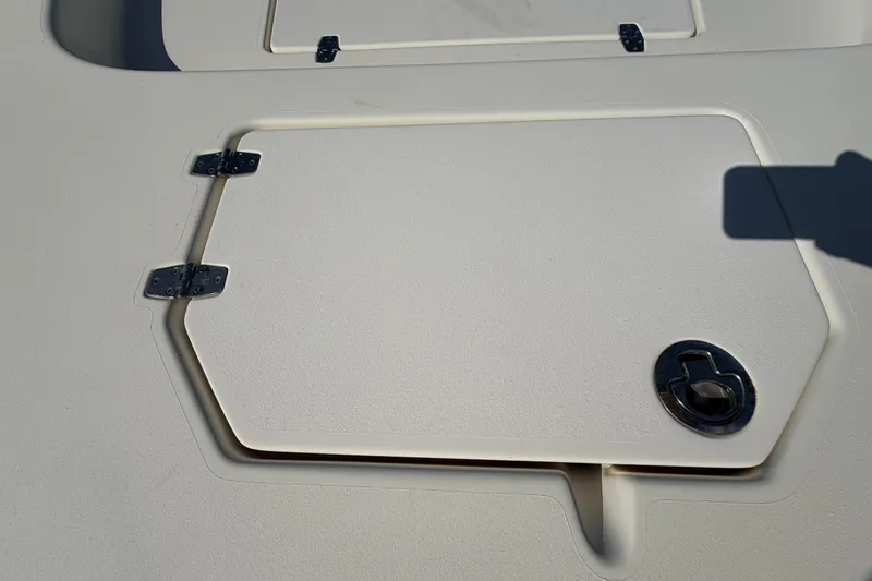 Slide: The Image of 2015 Pathfinder 2200 TRS boat on display at a dealership under clear skies. - 52