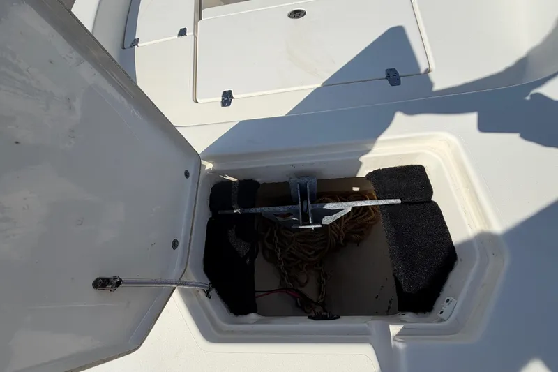 Slide: The Image of White seat on 2015 Pathfinder 2200 TRS boat, showing storage compartment. - 53