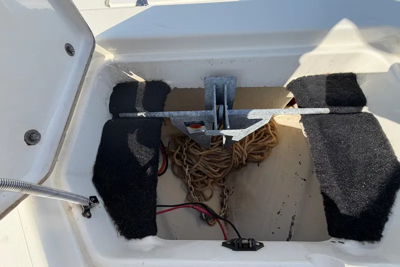 Slide: The Image of Open storage compartment on 2015 Pathfinder 2200 TRS boat, showing interior details. - 54