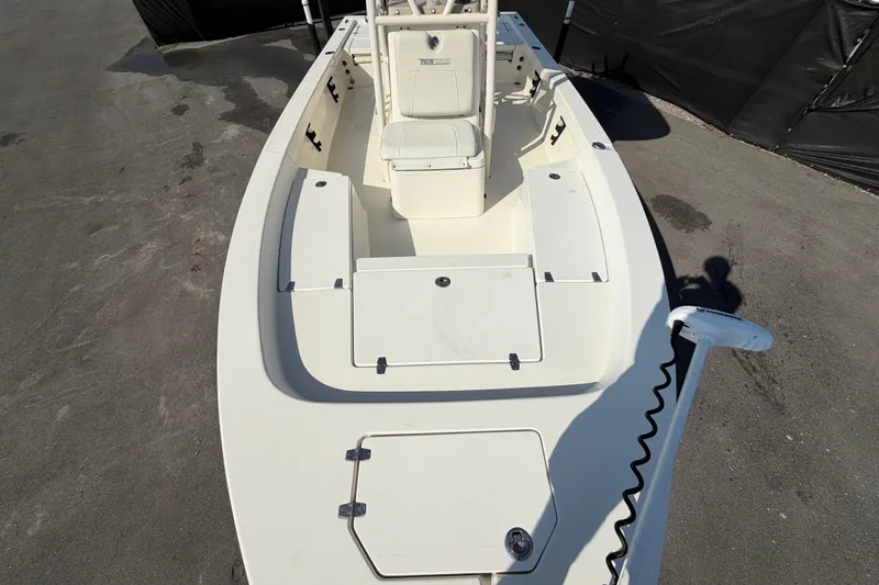 Slide: The Image of 2015 Pathfinder 2200 TRS boat console with steering wheel and navigation controls. - 55