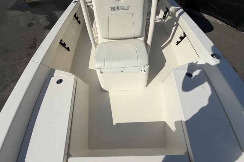 Slide: The Image of 2015 Pathfinder 2200 TRS boat interior with seating and Yamaha 200 engine. - 59