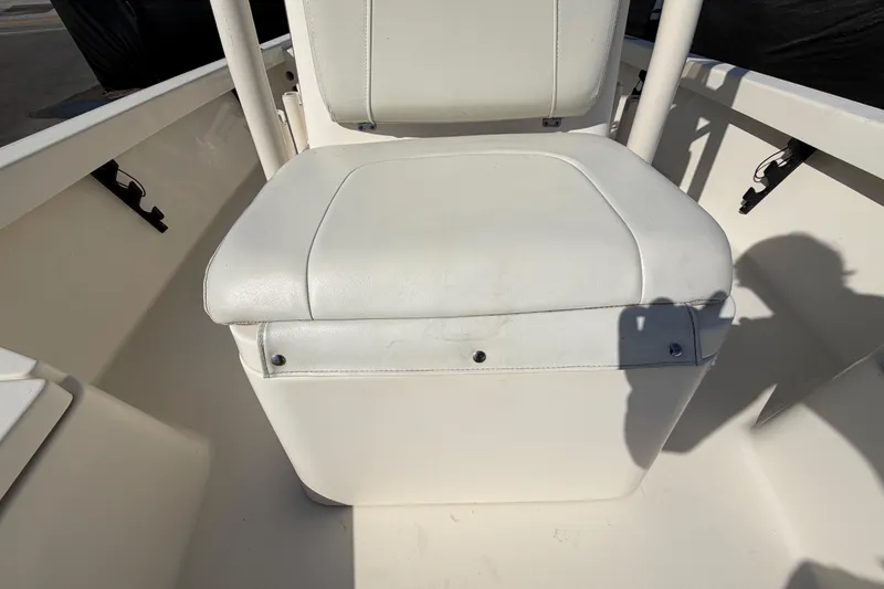 Slide: The Image of 2015 Pathfinder 2200 TRS boat deck with storage compartments and engine. - 62