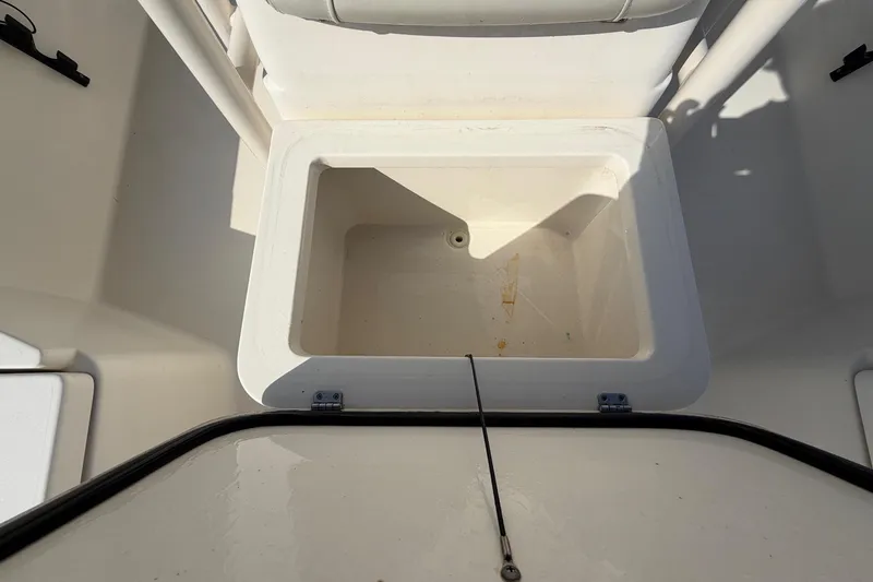 Slide: The Image of Open storage compartment on 2015 Pathfinder 2200 TRS boat deck. - 63