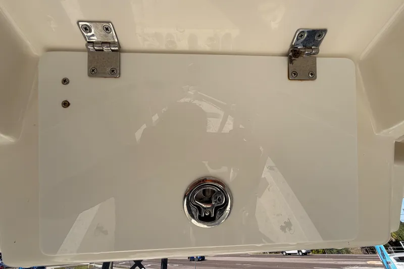Slide: The Image of 2015 Pathfinder 2200 TRS boat hatch with latch and hinges, viewed from above. - 66