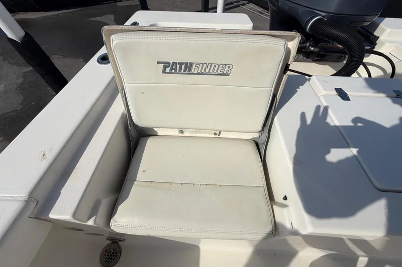 Slide: The Image of Open storage compartment on 2015 Pathfinder 2200 TRS boat, showing interior details. - 70