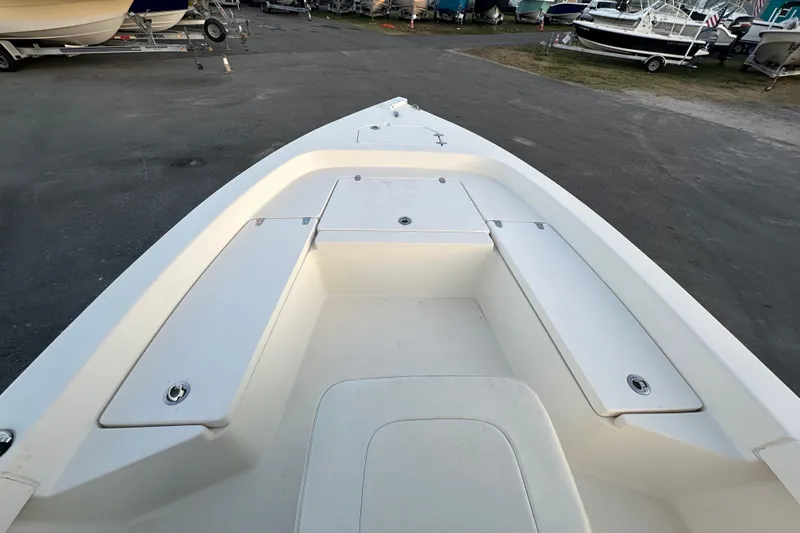 Slide: The Image of 2015 Pathfinder 2200 TRS boat on trailer at dealership, sunny day. - 9