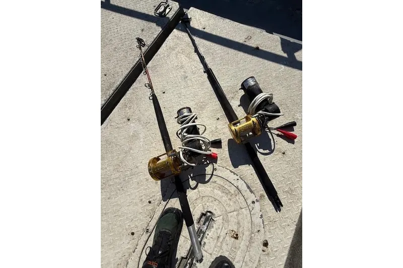 Slide: The Image of Fishing rods with reels on a boat deck, Willard Vega 30, 1982 model. - 15