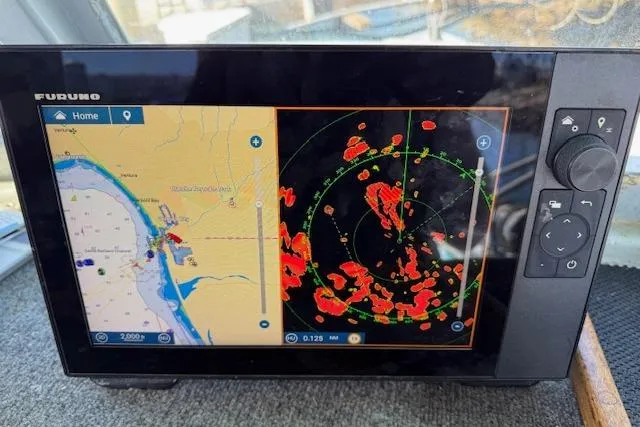 Slide: The Image of Navigation system on a 1982 Willard Vega 30 boat, displaying map and radar screens. - 19