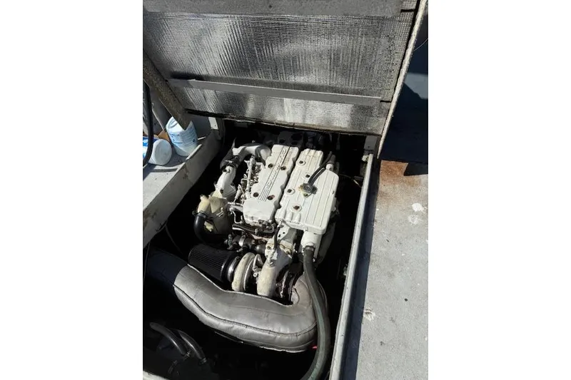 Slide: The Image of Engine compartment of a 1982 Willard Vega 30 boat, showcasing mechanical components. - 6