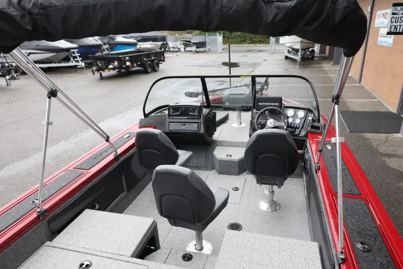 Slide: The Image of 2022 Tracker Targa V-19 Combo Tournament Edition boat interior with seating and dashboard. - 15