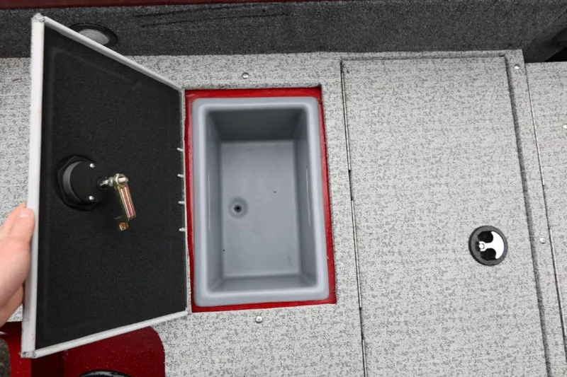 Slide: The Image of 2022 Tracker Targa V-19 Combo Tournament Edition boat storage compartment open. - 20