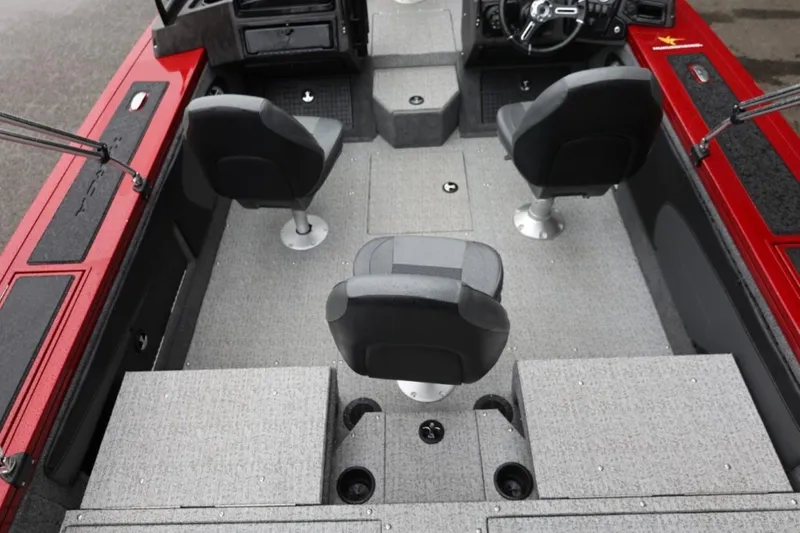 Slide: The Image of 2022 Tracker Targa V-19 Combo Tournament Edition boat interior with seating and steering console. - 23