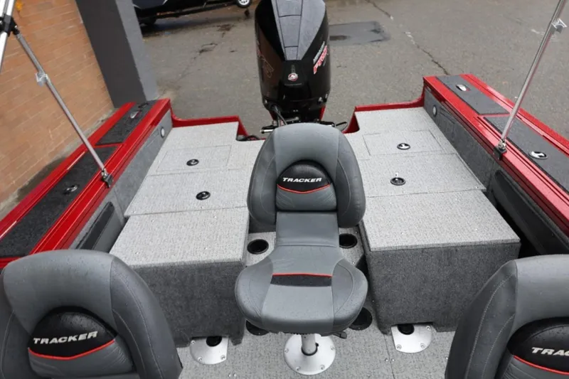 Slide: The Image of 2022 Tracker Targa V-19 Combo Tournament Edition boat interior with seating and storage. - 25