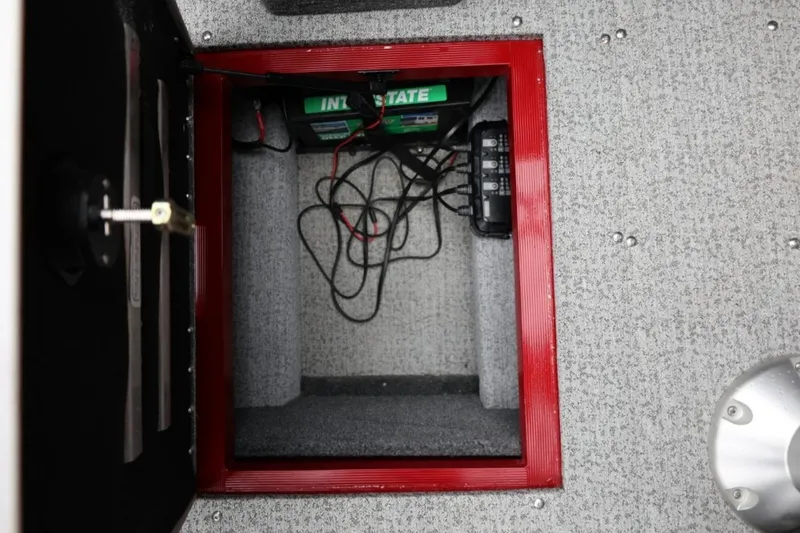 Slide: The Image of 2022 Tracker Targa V-19 Combo Tournament Edition battery compartment with wiring and components. - 50