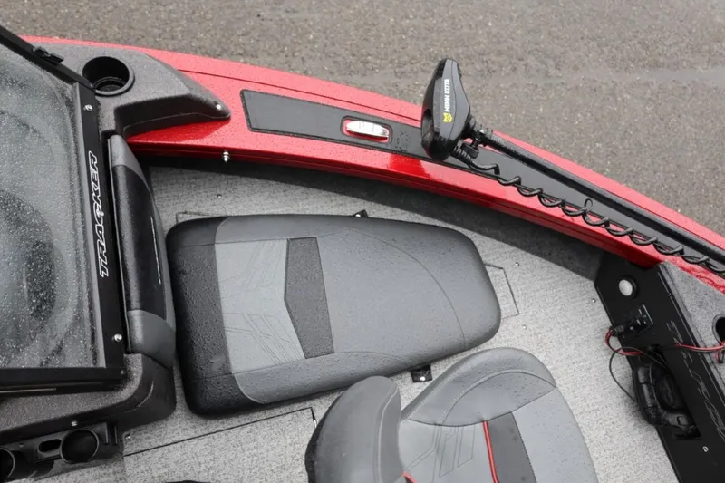 Slide: The Image of 2022 Tracker Targa V-19 Combo Tournament Edition boat interior with seats and trolling motor. - 53