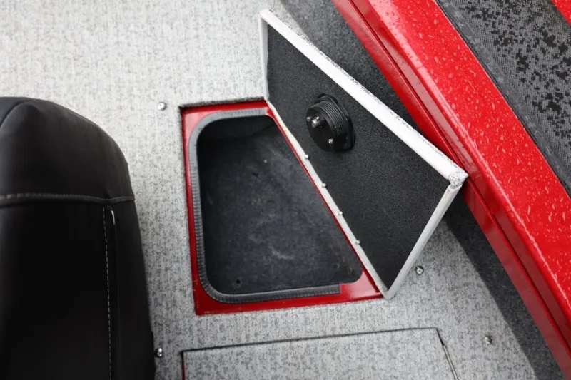 Slide: The Image of 2022 Tracker Targa V-19 Combo Tournament Edition boat storage compartment open. - 59