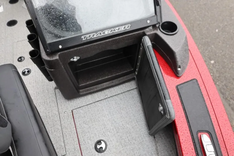 Slide: The Image of 2022 Tracker Targa V-19 Combo Tournament Edition boat dashboard with storage compartment open. - 61
