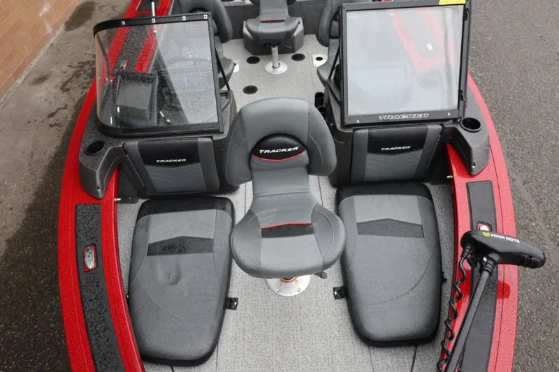 Slide: The Image of 2022 Tracker Targa V-19 Combo Tournament Edition boat interior with seating and controls. - 62