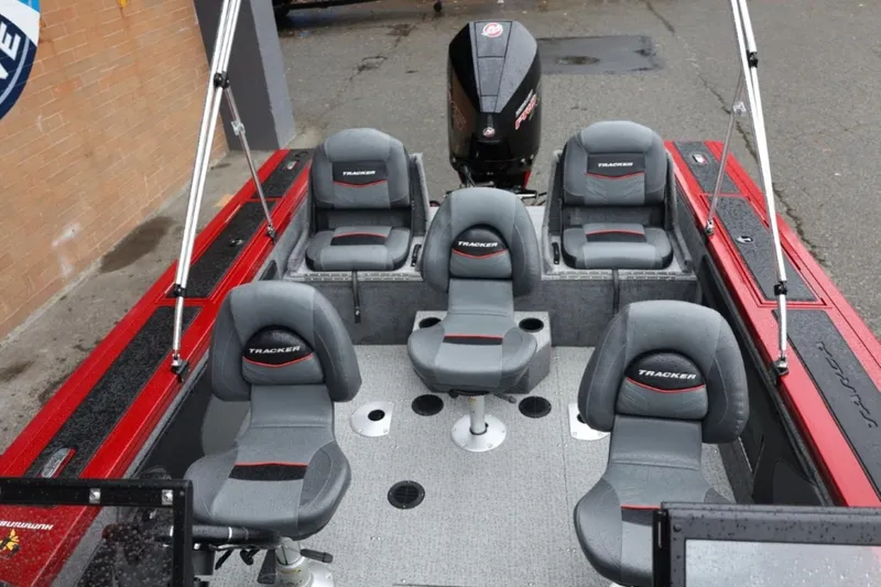 Slide: The Image of 2022 Tracker Targa V-19 Combo Tournament Edition boat interior with seating and motor. - 72