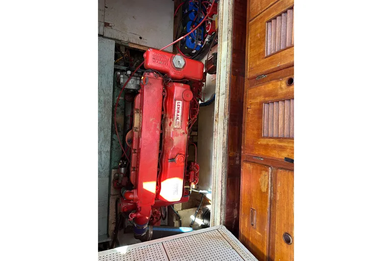 Slide: The Image of 1979 Marine Trader 38DC engine compartment with red Lehman engine. - 49