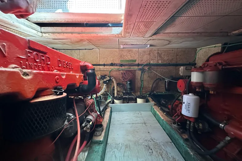 Slide: The Image of Engine room of a 1979 Marine Trader 38DC with Ford diesel engines. - 54